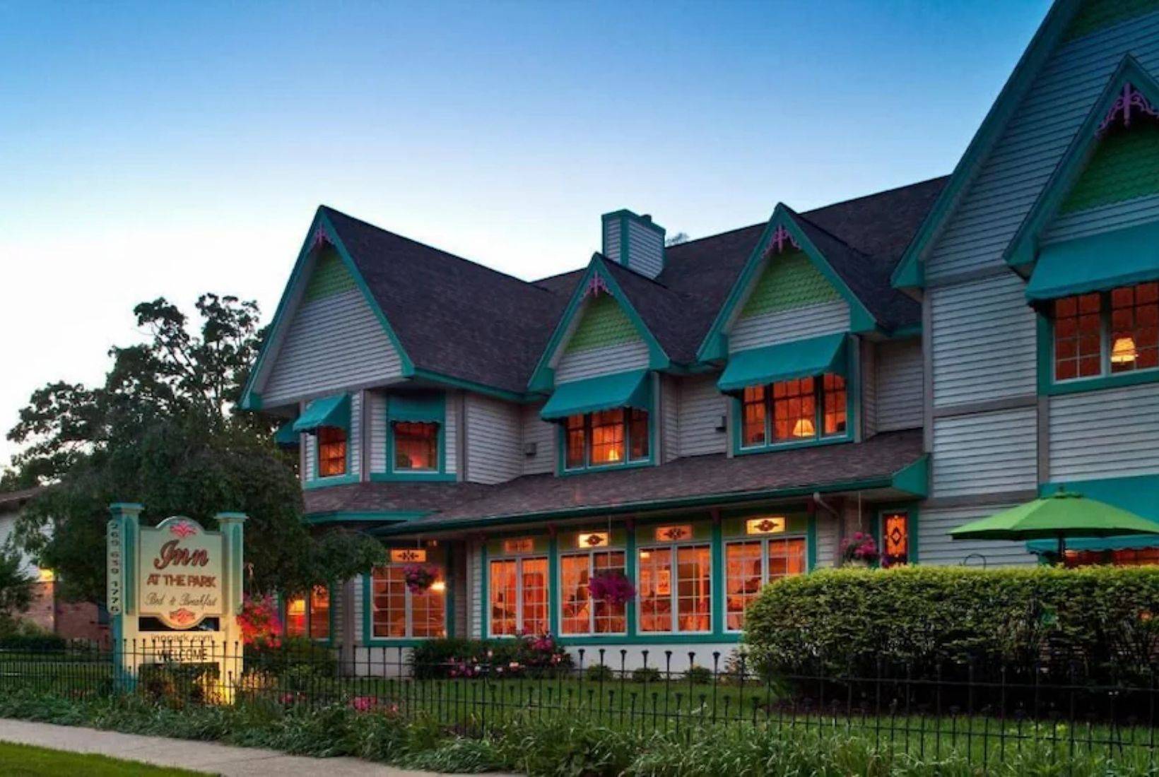 Victorian-style Inn at the Park Bed & Breakfast in South Haven with warm evening lighting.