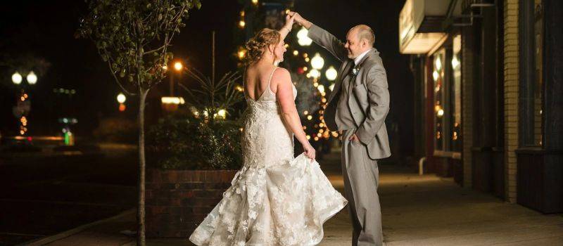 Lake Michigan wedding venue evening celebration with bride and groom dancing outdoors