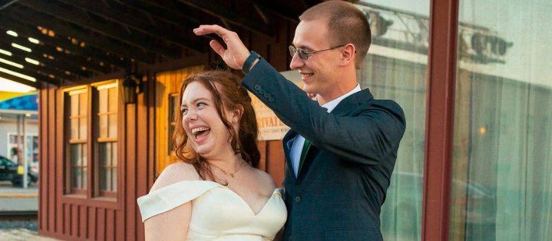 outdoor spring weddings Michigan wedding venue couple dancing outdoors at rustic barn wedding reception
